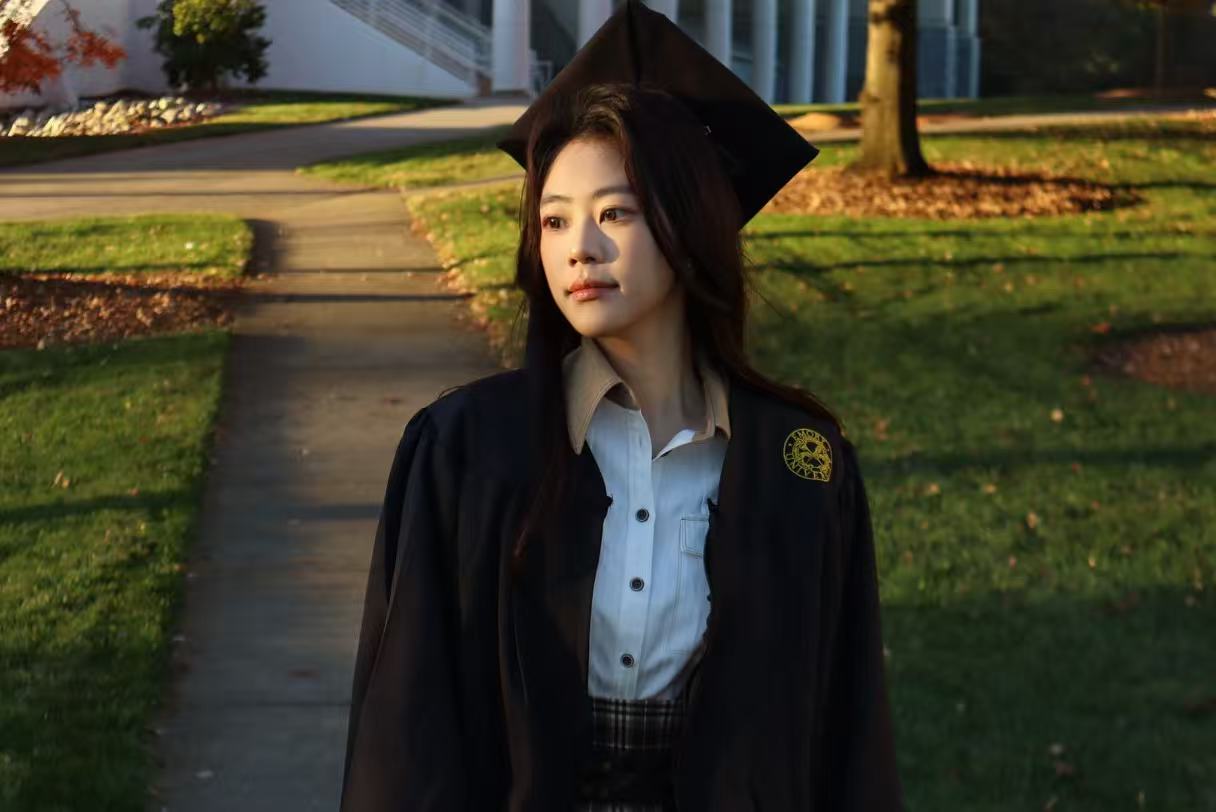 Rebecca in cap and gown at Emory graduation